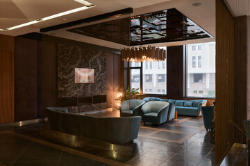 waiting area in a modern house, large space for communication, tv area, fireplace