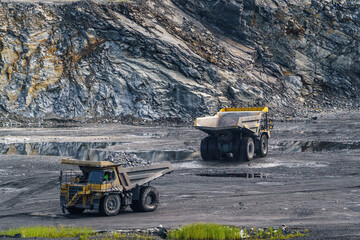 Dump truck in limestone mining, heavy machinery. Mining in the quarry.