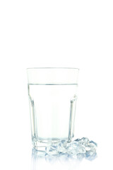 Glass of water and ice isolated on white background