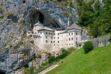 Fototapeta premium Scenic view of Predjama castle near Postojna, Slovenia at sunny summer day