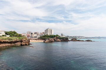 Fototapeta premium View of Basque part of Biarritz city from rocks&nbsp;Rocher de la Vierge. Pyrenees-Atlantiques department, French Basque Country