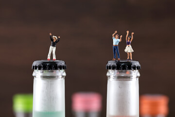 Cheering alcoholic on creative wine bottle in miniature