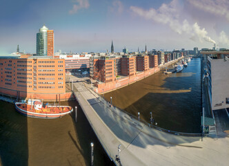 Hamburg view to the Sandtorhafen area with bricked wall buildings and sunlight with blue sky