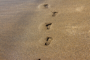 Fototapeta na wymiar footprints in sand , footprint in the beach