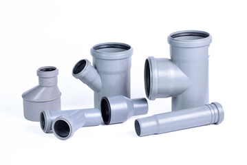 Plumbing fixtures and piping parts plastic fittings isolated on a white background