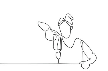 a female repairwoman fixes something and works with a piercing tool in her hand