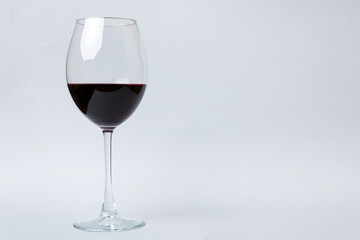 One glasses of red wine at wine tasting. Concept of red wine on colored background. Top view, flat lay design