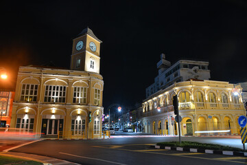 Fototapeta na wymiar PHUKET, THAILAND - March 21 2022: Old Police Station with Clock Tower (Left) and Phuket Museum (Right) Now Become the Landmarks of Chino Portuguese Building in Phuket Town.