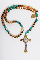 Male Christian rosary for prayer on a white background