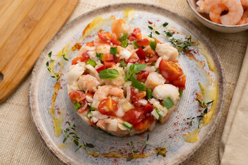 Seafood splash with hake and prawns. Spanish traditional tapas.