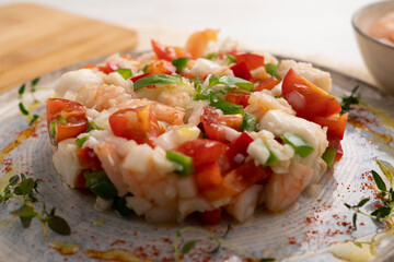 Seafood splash with hake and prawns. Spanish traditional tapas.