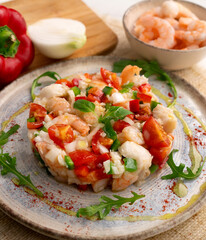 Seafood splash with hake and prawns. Spanish traditional tapas.
