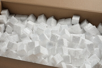 Closeup view of cardboard box with styrofoam cubes