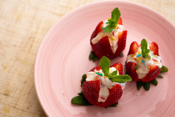 Strawberries stuffed with cream. Traditional Barcelona dessert.