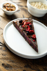 Vegan chocolate cake with wild berries