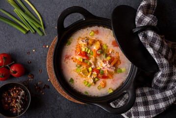 Salmon fish soup with vegetables, hot healthy food