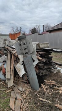 War of Russia against Ukraine. Streets of Mykolaiv during the war. Fragment of rocket - missile hit the private sector. Volley rocket fire system.