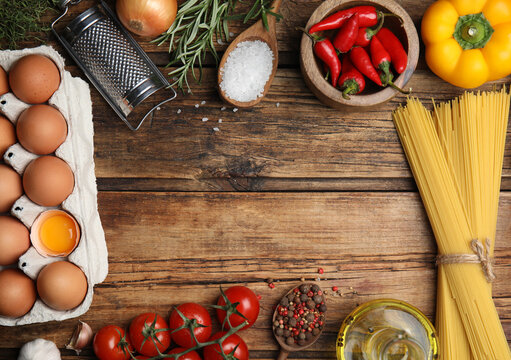 Frame Made Of Cooking Utensils And Fresh Food On Wooden Table, Flat Lay. Space For Text