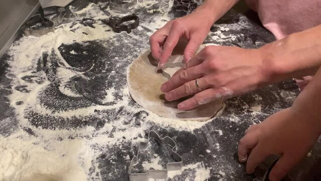 The process of making gingerbread cookies with molds for Easter