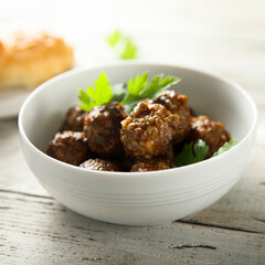 Homemade meatballs in a white bowl