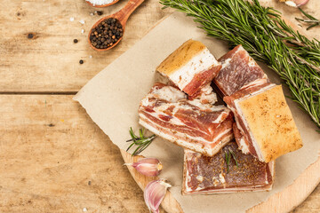 Pieces of salty high-fat meat cooked with spices. Salo, bacon, lard, silverside, gammon