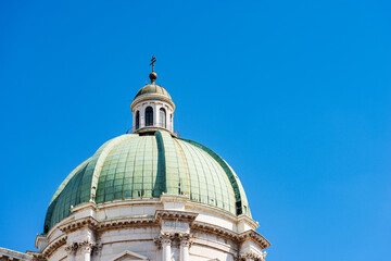 Fototapeta na wymiar Dome and lantern of the Cathedral of Santa Maria Assunta,1604-1825 in Brescia downtown, in late Baroque style, also called Duomo nuovo. Cathedral square or Paolo VI square. Lombardy, Italy, Europe.