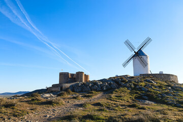 old windmills and castle in the city of Consuegra (Spain), on the route of the Don Quixote and Cervantes mills