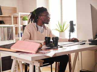 Graphic designer photographer working in home office