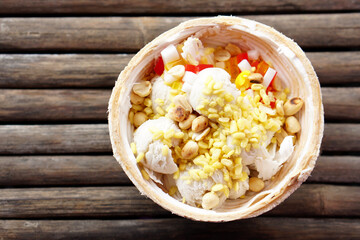 fresh coconut ice cream on wooden floor
