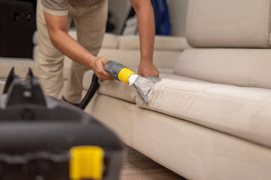 Cleaning a dirty sofa with a sofa washer