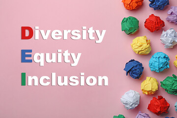 Abbreviation DEI - Diversity, Equity, Inclusion and colorful paper balls on pink background, flat...