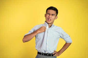 portrait of young asian businessman feeling the hot weather