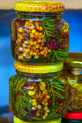 Jars with honey and berries close-up