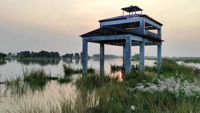 Video footage of an isolated cremation ground surrounded by floodwaters at sunset