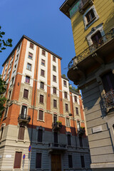 Fototapeta na wymiar Old buildings in Milan at via Revere and Largo V Alpini