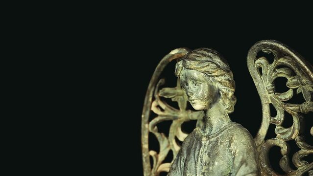 footage of angel statue dark background