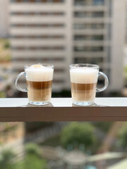 Cups of coffee on the balcony