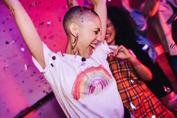 Woman dancing with her friends at a house party