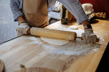 Cooking Georgian dish khinkali with dough and meat