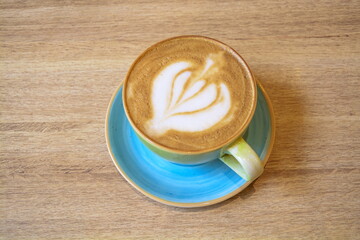 Hot cappuccino with a beautiful foam in an elegant ceramic cup