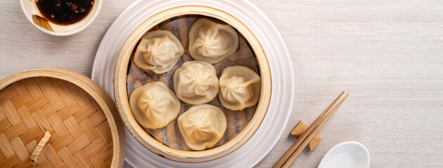 Fototapeta na wymiar Steamed pork soup dumplings named Xiao long bao xiaolongbao in Taiwan.