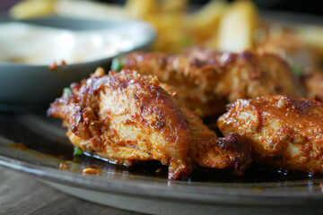 close up of slice of grill chicken on a plate 
