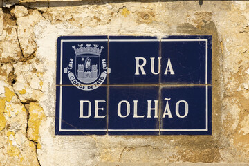 Fototapeta premium Old azulejos tiles on a facade in the village of Estoi, Algarve, Portugal