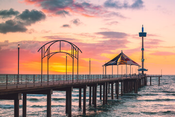 Brighton jetty at dramatic sunset viewed from Esplanade, South Australia