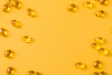 Close up of  oil filled capsules suitable for: fish oil, omega 3, omega 6, omega 9,  vitamin A, vitamin D, vitamin D3, vitamin E - Image