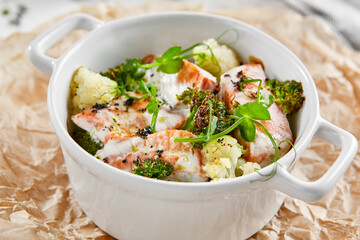 Healthy eating: steamed vegetables with salmon. Healthy salmon meal with broccoli and cauliflower....