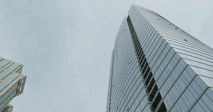 Driving Beneath Tilting Up At Tall Office Building Downtown