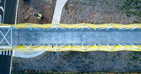 top down drone shot of a pedestrian bridge