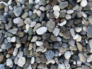 gray large pebbles. pebble beach. stones for landscape design. background.