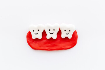 Teeth models with caries or plaque on gums. Oral health concept